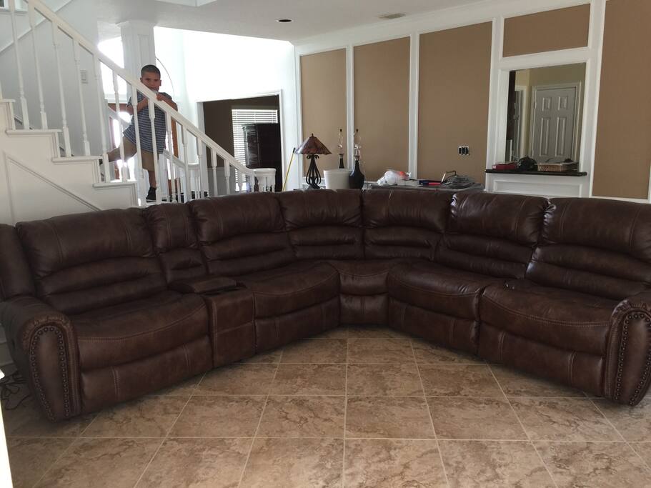 Come relax in the Living room. Sectional has three recliner chairs.