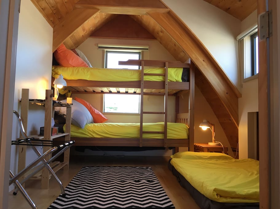 ‘Kids’ bedroom with bunk bed and an extra mattress,if needed, on ground. Also upstairs