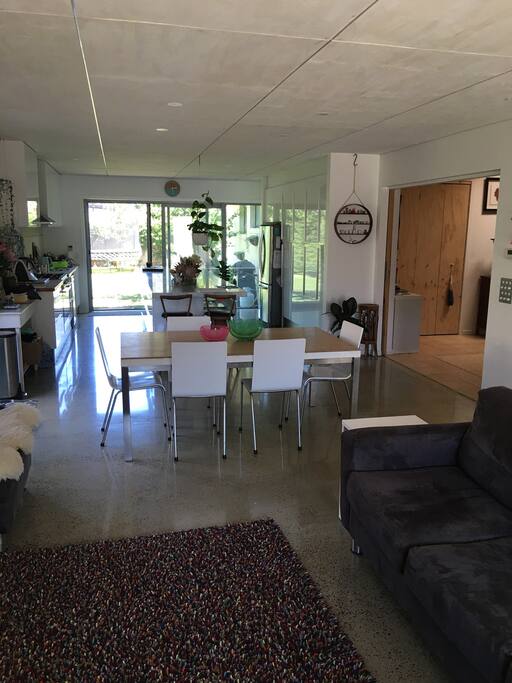 Living space looking to meals and kitchen area