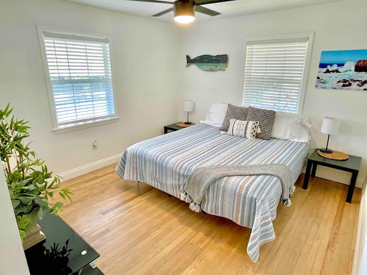 King sized bed, ceiling fan, and bedside lamps with built in USB port for your convenience. 