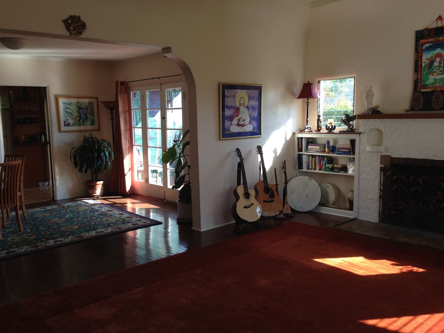 Living room into dining. French doors open to side patio with mural