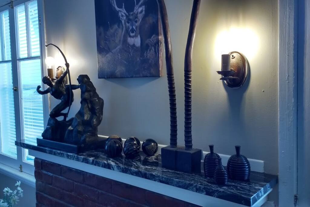 Dimeable lighting above the fireplace to enhance the mood