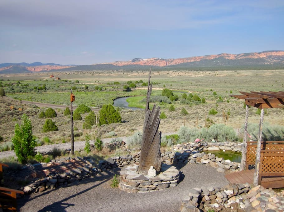 View of yard, Sevier River Valley, and spectacular red cliffs beyond