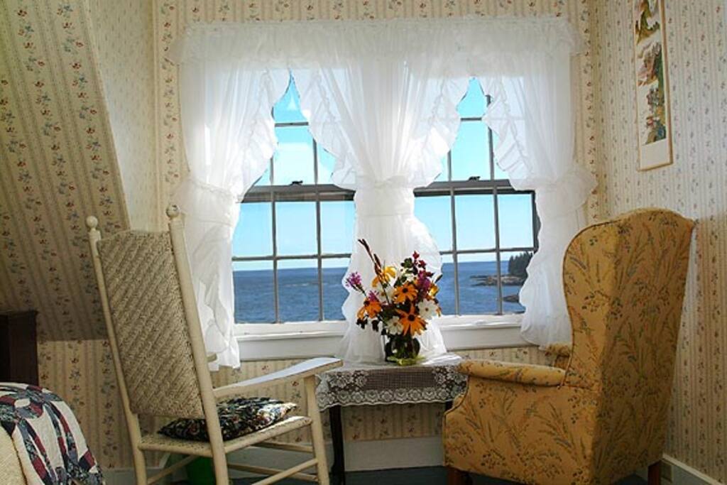 Room 4 in the 1860's Sea Captains House of Acadia's Oceanside Meadows Inn that commands a wonderful view of the waves crashing on the shore of our private sandy beach five minutes from Acadia National Park at Schoodic.