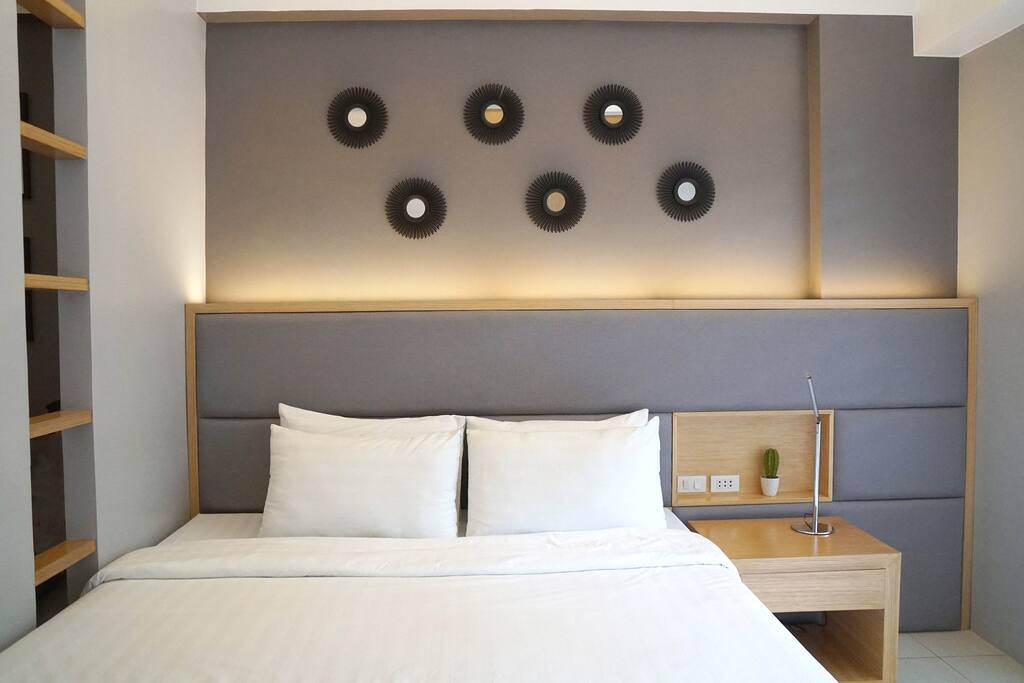 Cozy bed with headboard lighting