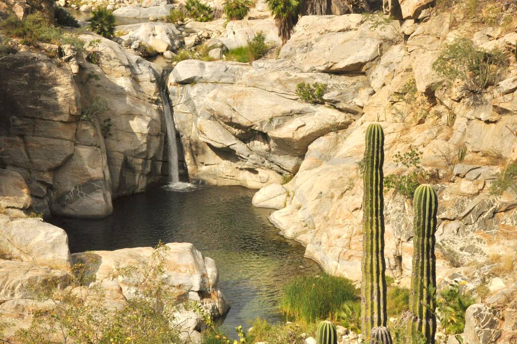 The waterfall, about 35 ft high and just 10 minutes walking from the cabins. And yes, you can jump or slide from the top.