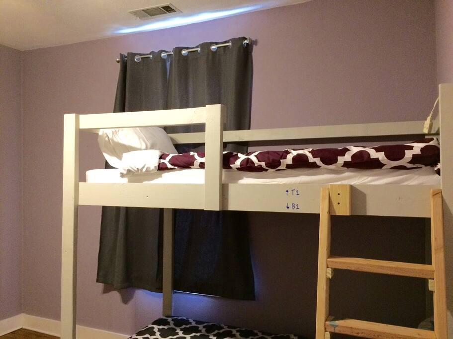 Your bed is the top bunk (T1).