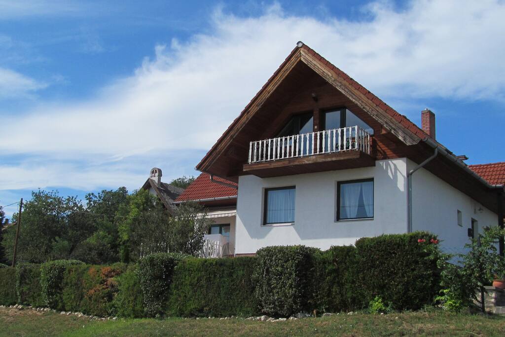 The house itself. The flat is on the ground floor (behind the hedge on the picture), with direct access from the garden.