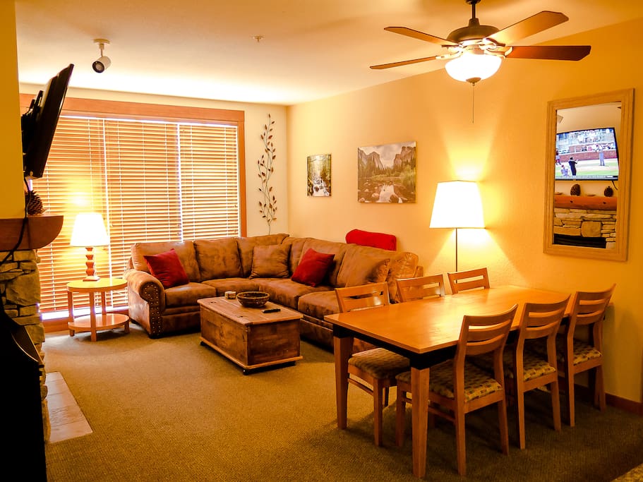 Luxury oversized sectional sofa, 55-inch HDTV+Dish, bar, gas fireplace, and beautiful artwork await you!