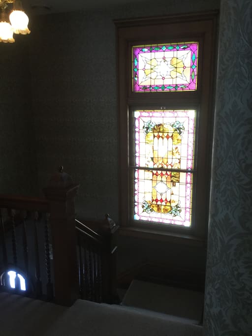 Front stairs with original stained glass