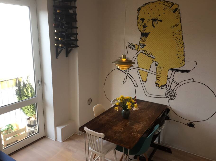 Dining table and a cosy balcony with sunshine all day