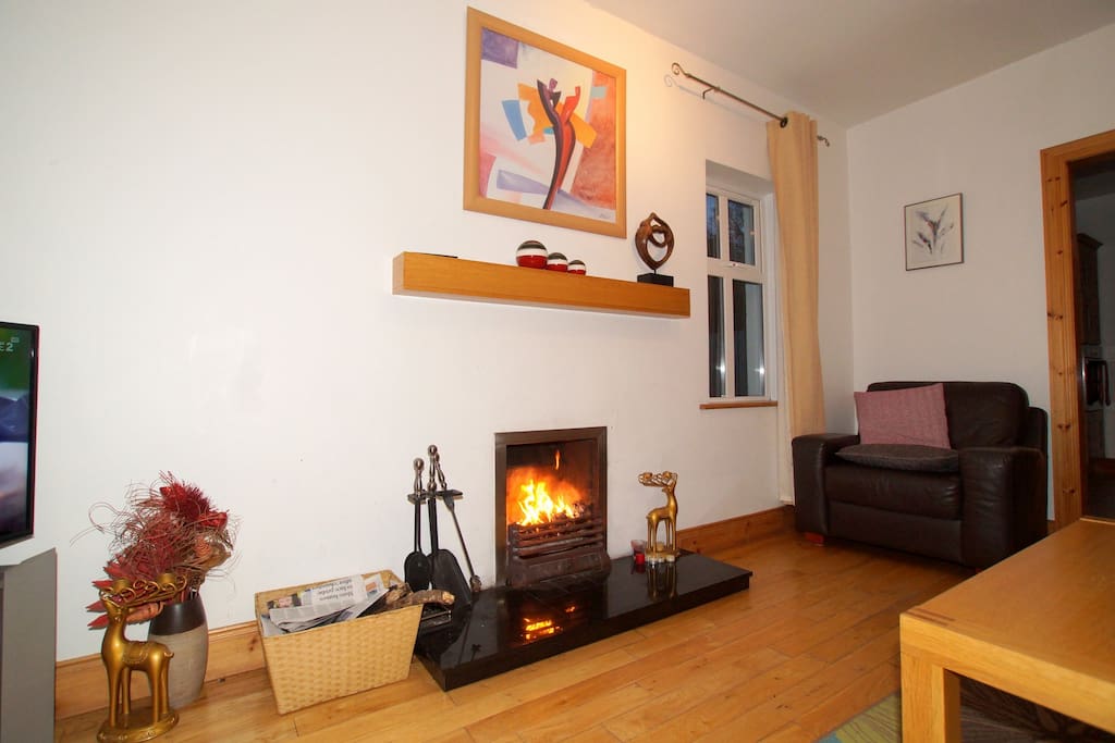 The living area has an open fireplace