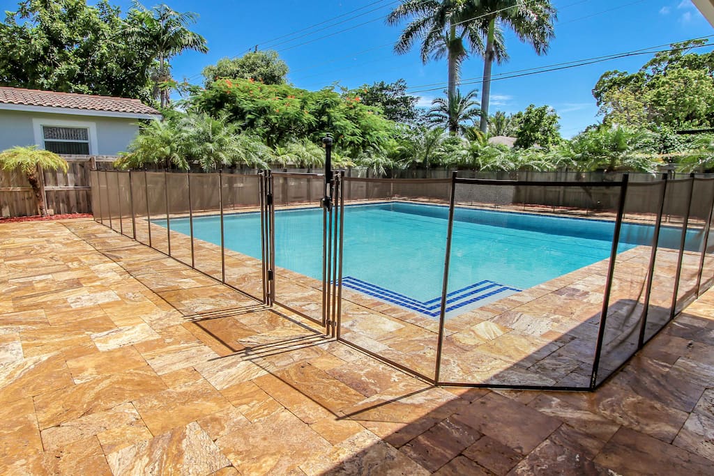 Pool with removable, lockable child-proof fence with gate.