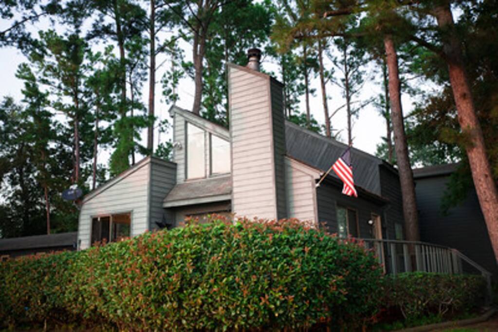 View Home with Well-Manicured Grounds & American Flag Waving