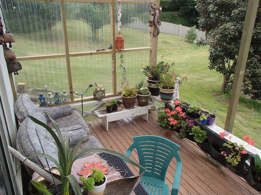 Sitting peacefully with a glass of wine, enjoying the view.