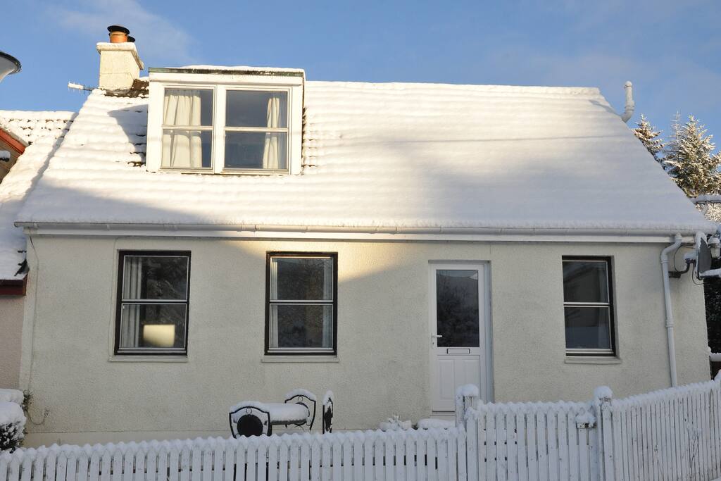 front view of house on a snowy December day