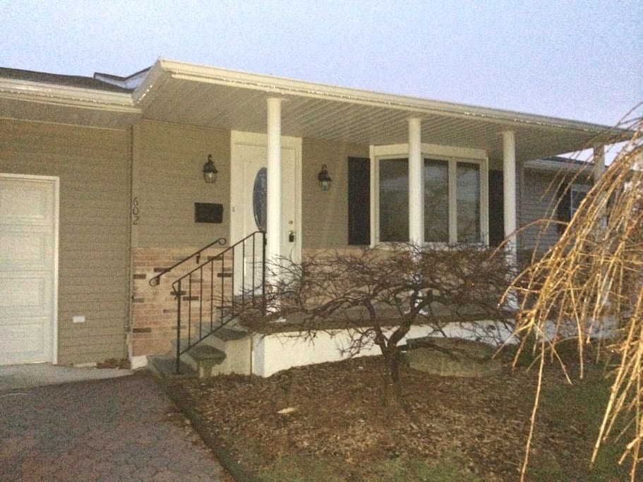 Front exterior of house. Garage is spacious and plenty if curb space to park