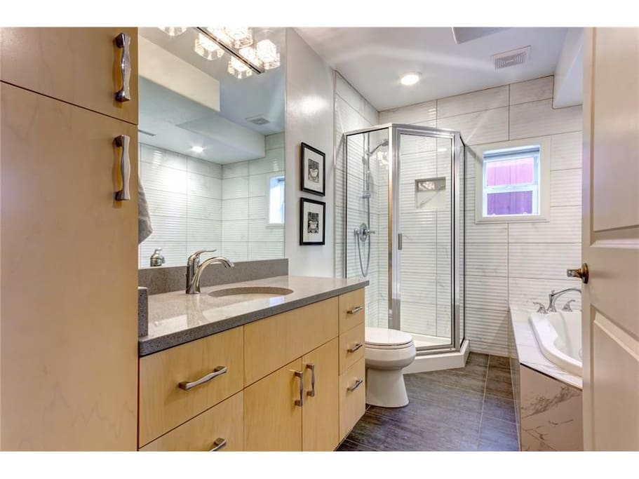 Bathroom with shower, jetted tub and heated floor.