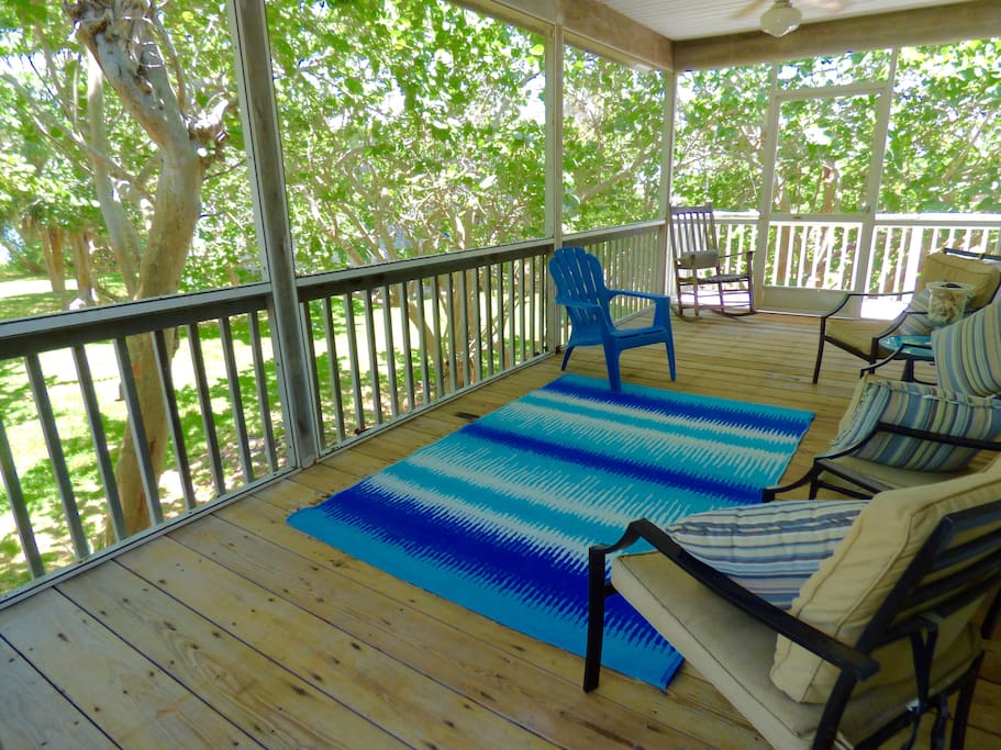 Screened porch has bay views and cooling breezes