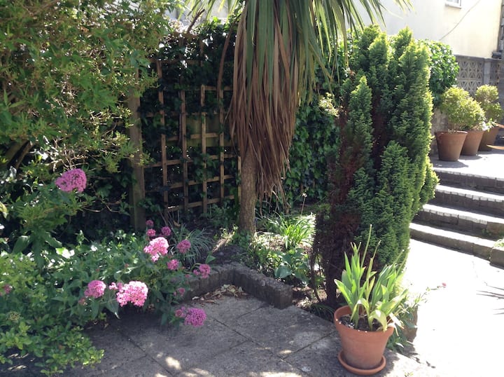 In charming garden flat by the sea