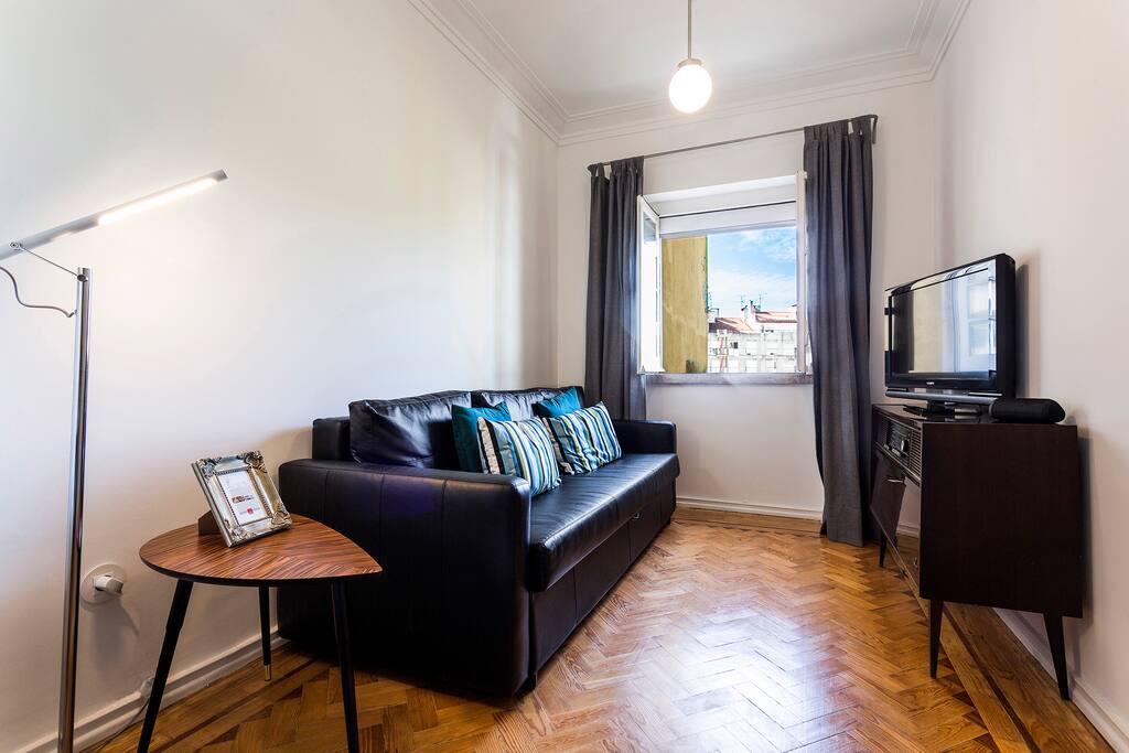 Living room with sofa bed and a vintage Radio!