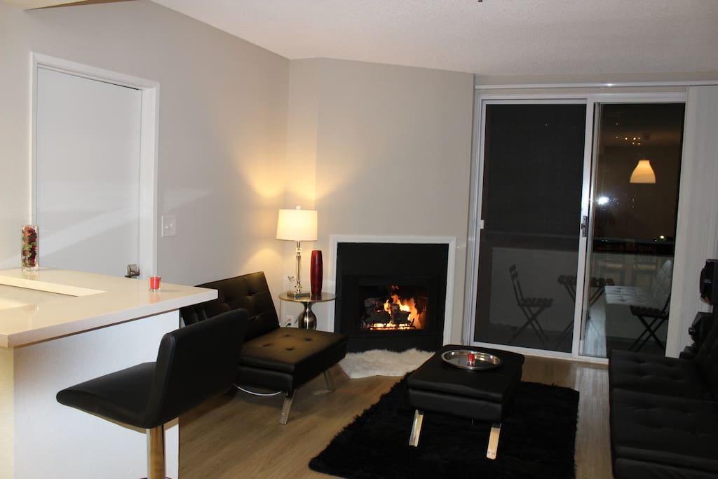 Living room at night. Enjoy a drink by the Fireplace