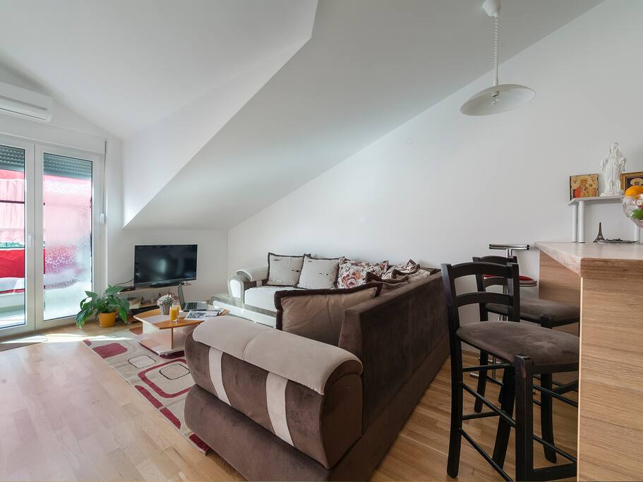 this is a comfortable living room, illuminated and pleasant, overlooking the city and the balcony, guests spend the most time here, very comfortable and provided for a real holiday.