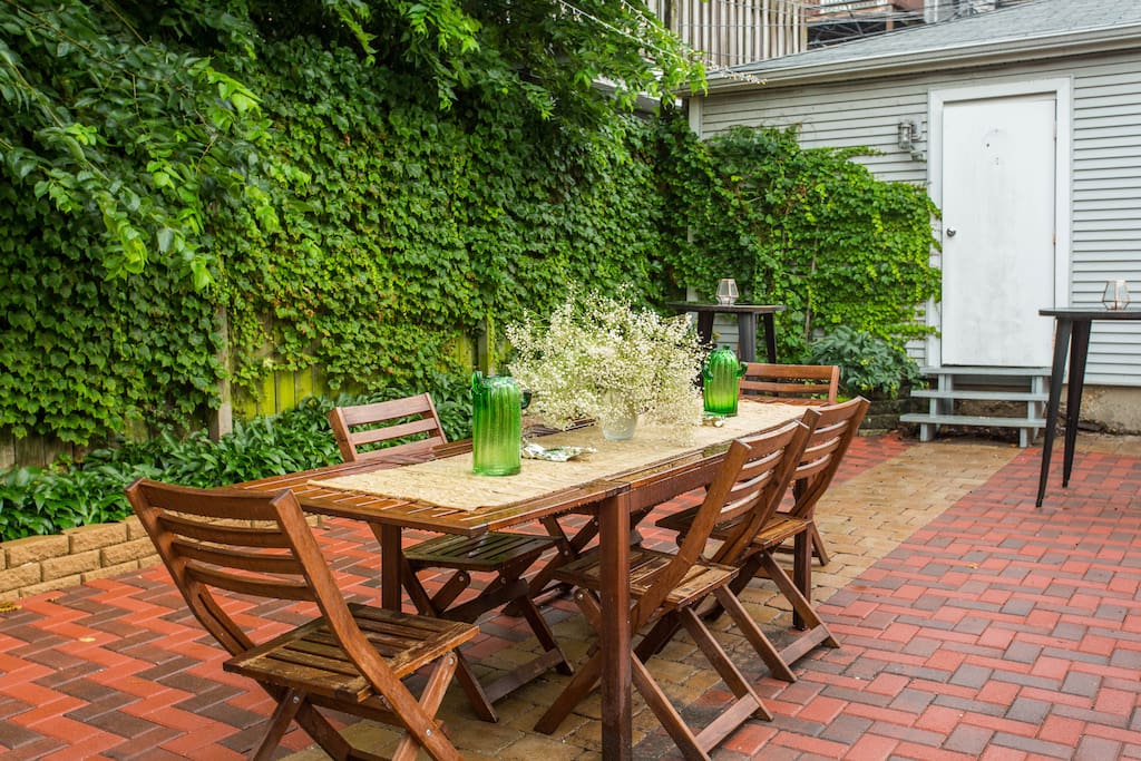 Backyard dining area perfect for moonlit summer dinners and outdoor home cooked brunches