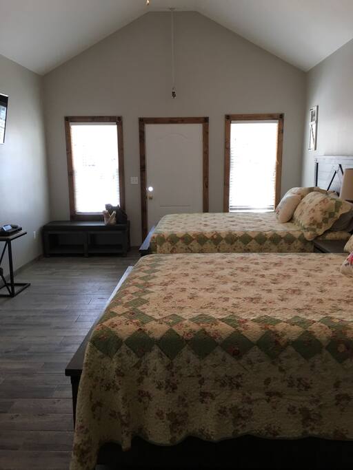 Two queen beds with USB ports in the headboard.