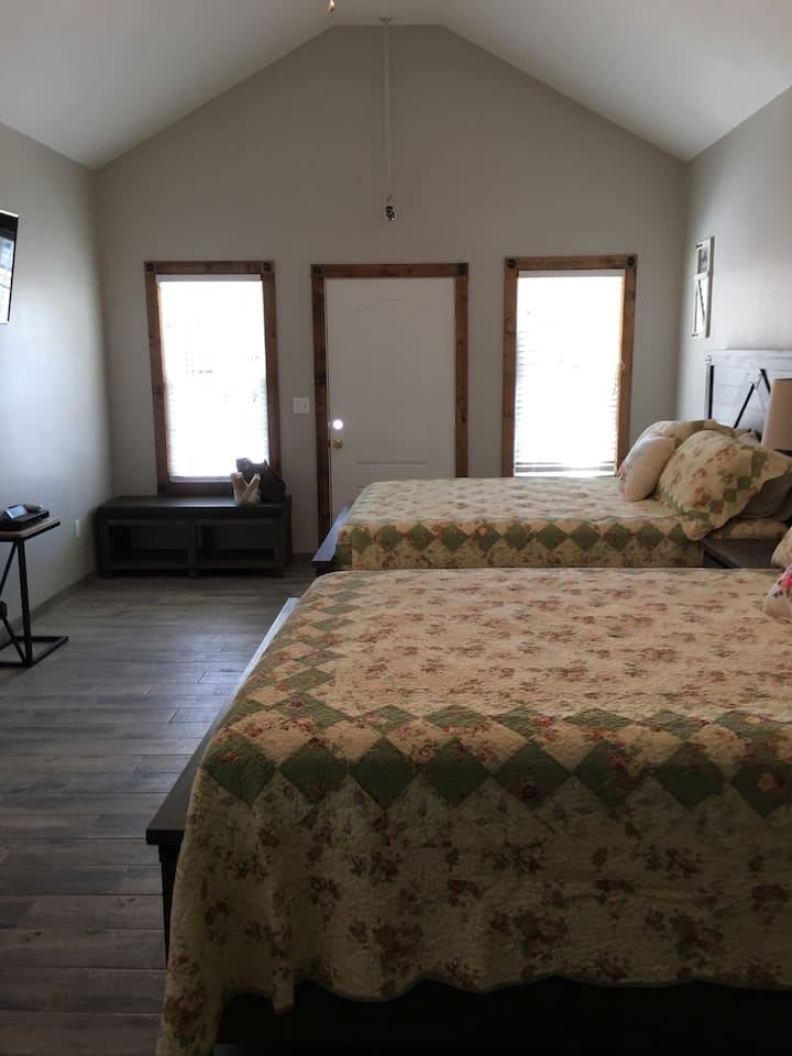 Two queen beds with USB ports in the headboard. 