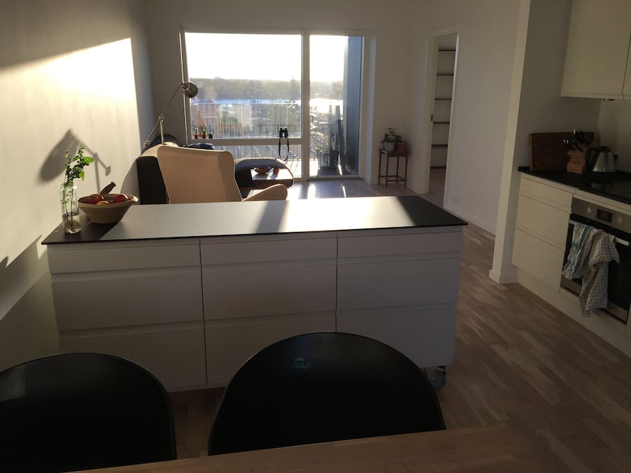 View from kitchen to the sitting room and bedroom on the right.