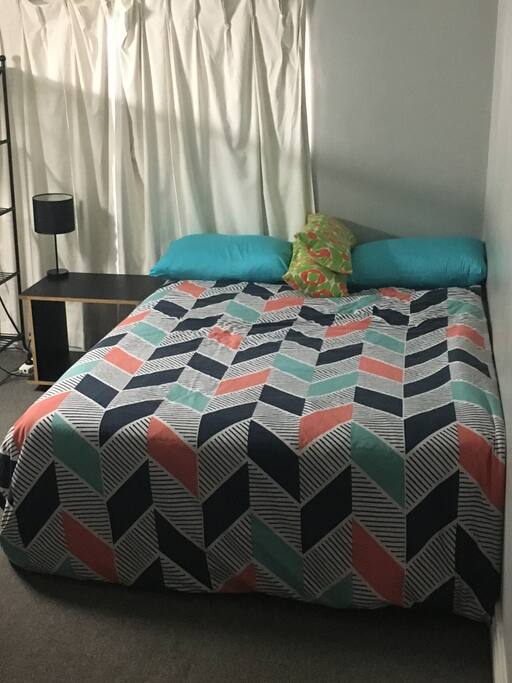 This is the room located downstairs, in the second level. There are some stairs to access to it. There's a window but can't be opened. There's an inner storage - wardrobe.