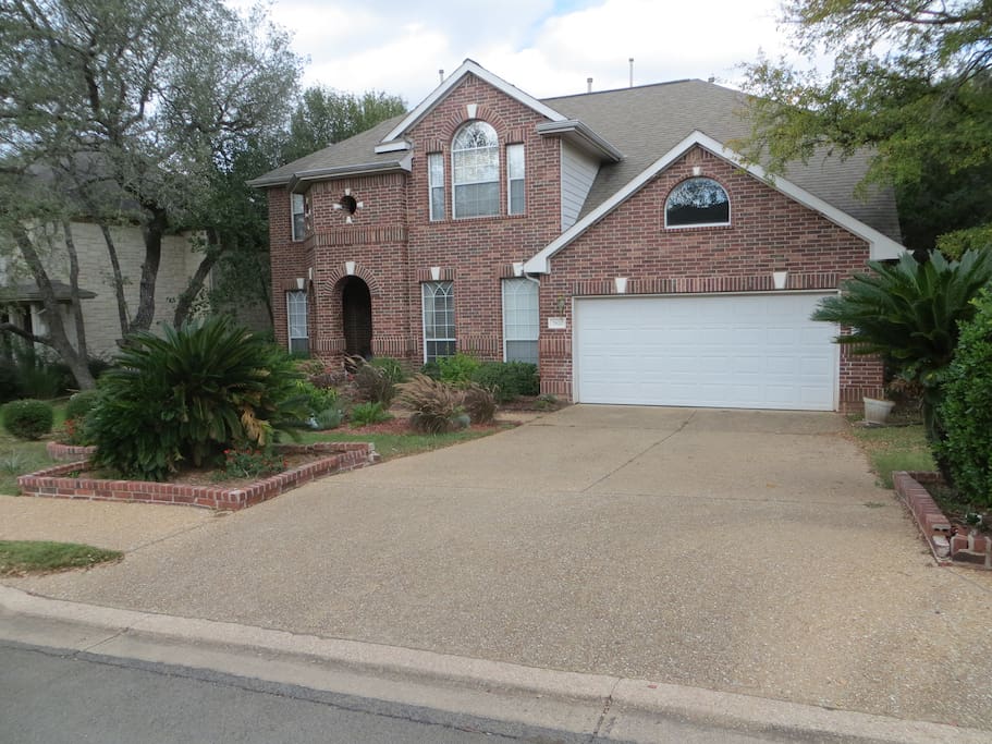 Front of house with 4 parking spots reserved in front of garage. inside garage off limits.