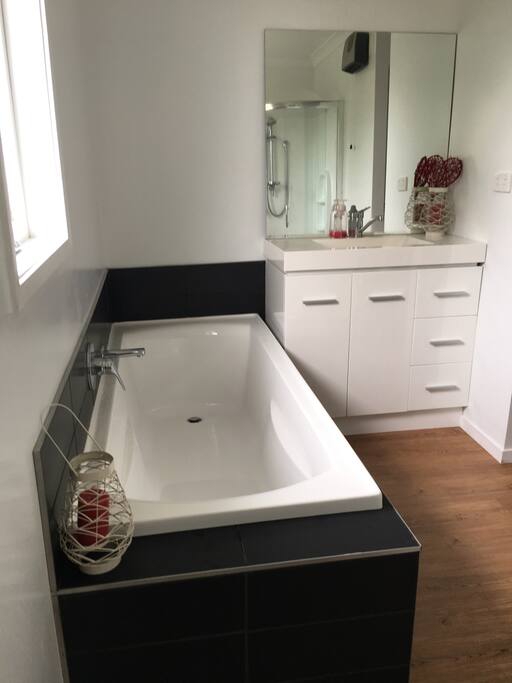 Shared bathroom: sink and bath
