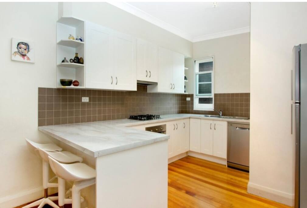 Modern kitchen equipped with everything you need including pots and pans, cutlery, plates, glasses etc. plus a reasonably stocked pantry of essentials such as salt, pepper, olive oil, tea coffee. 