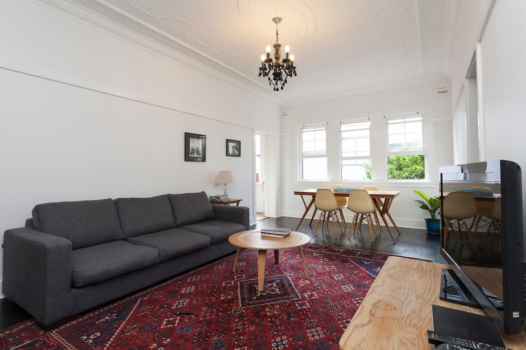 Very light and open plan Living/Dining area with 3 seater couch, 6 seater dining table.