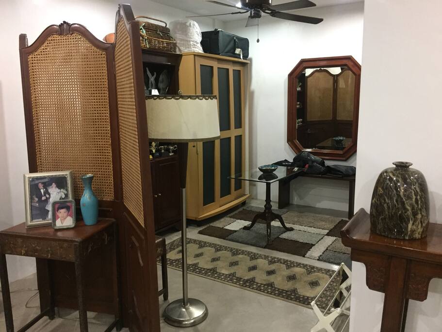 As you turn to the right, is the dresser. The bathroom is to your right.