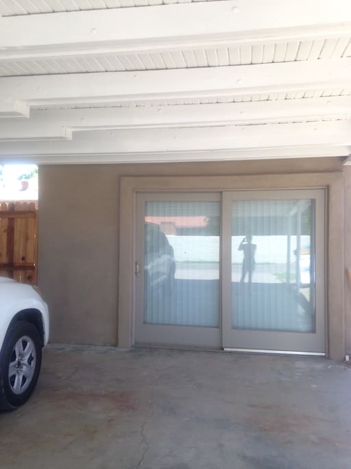 This is the covered parking spot you may use and the double doors go into the private unit.