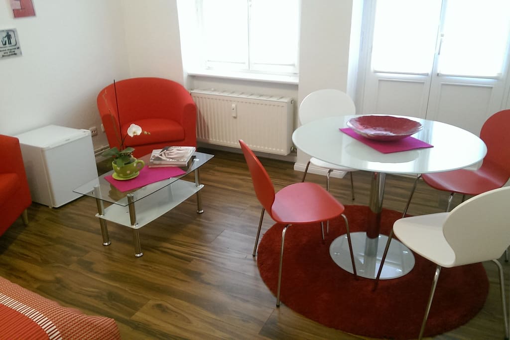 Bedroom with sitting space and glass table