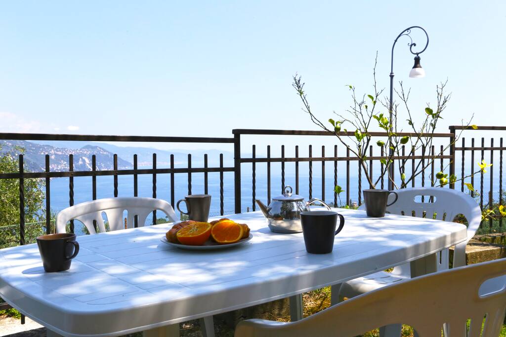 Garden with table for outdoor dining and sea view