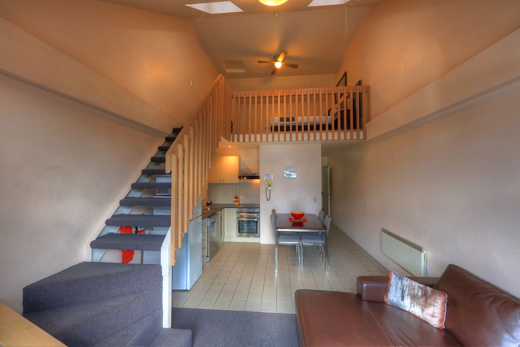 Steps up to the open plan loft bedroom