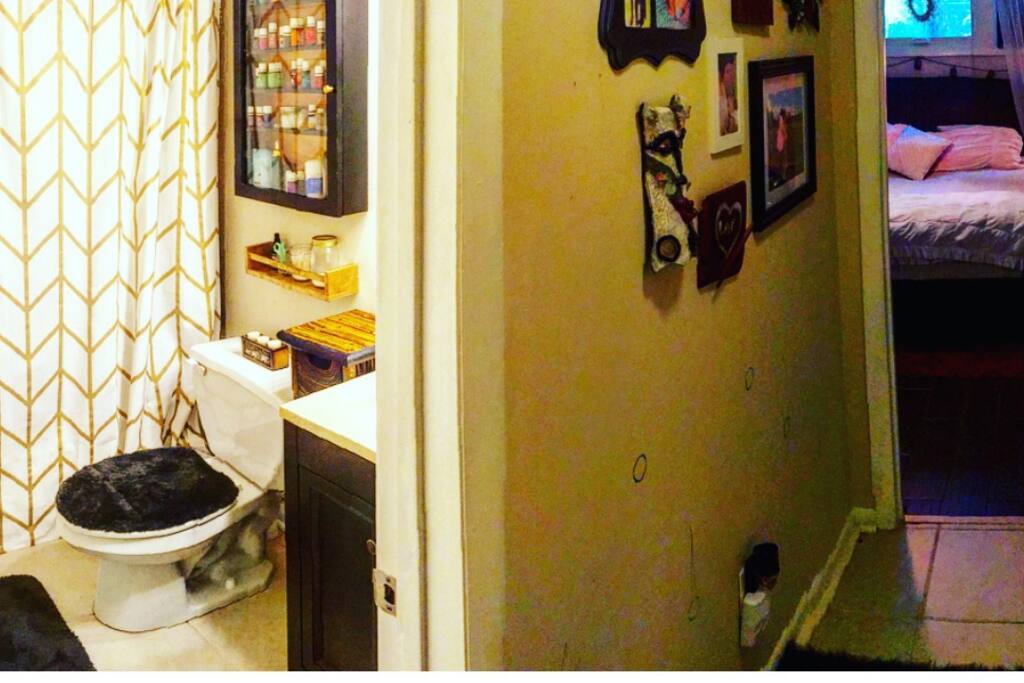 Private full bath and private hallway to bedroom.