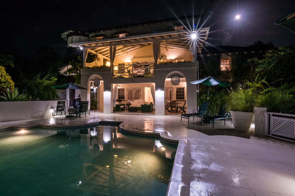 The private pool is well lit at night.
