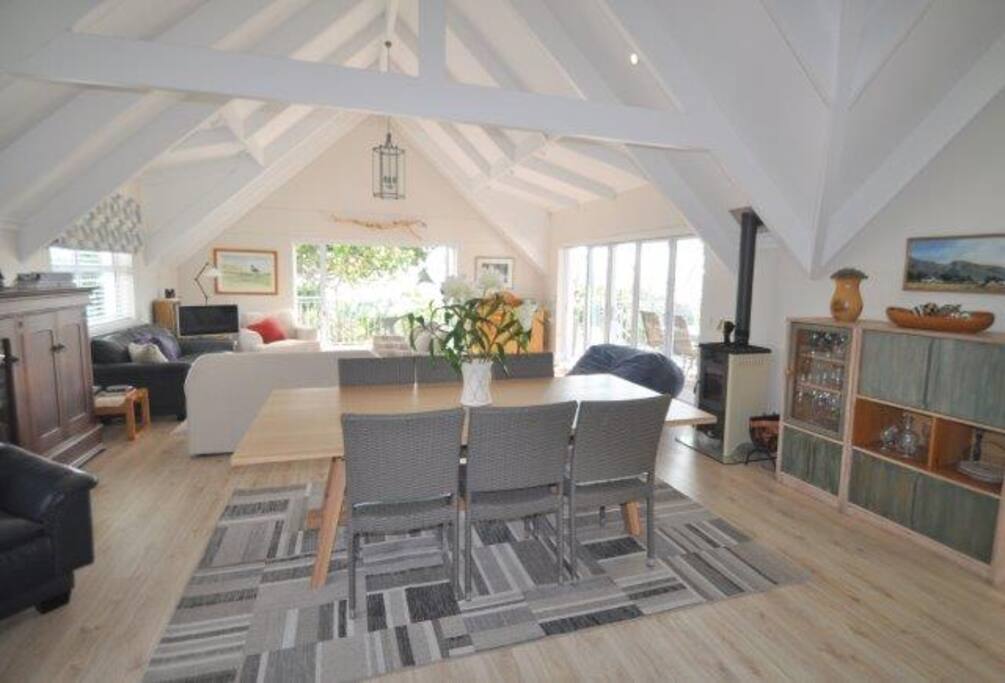 The spectacular upstairs lounge with indoor dining and a luxurious wood burning stove