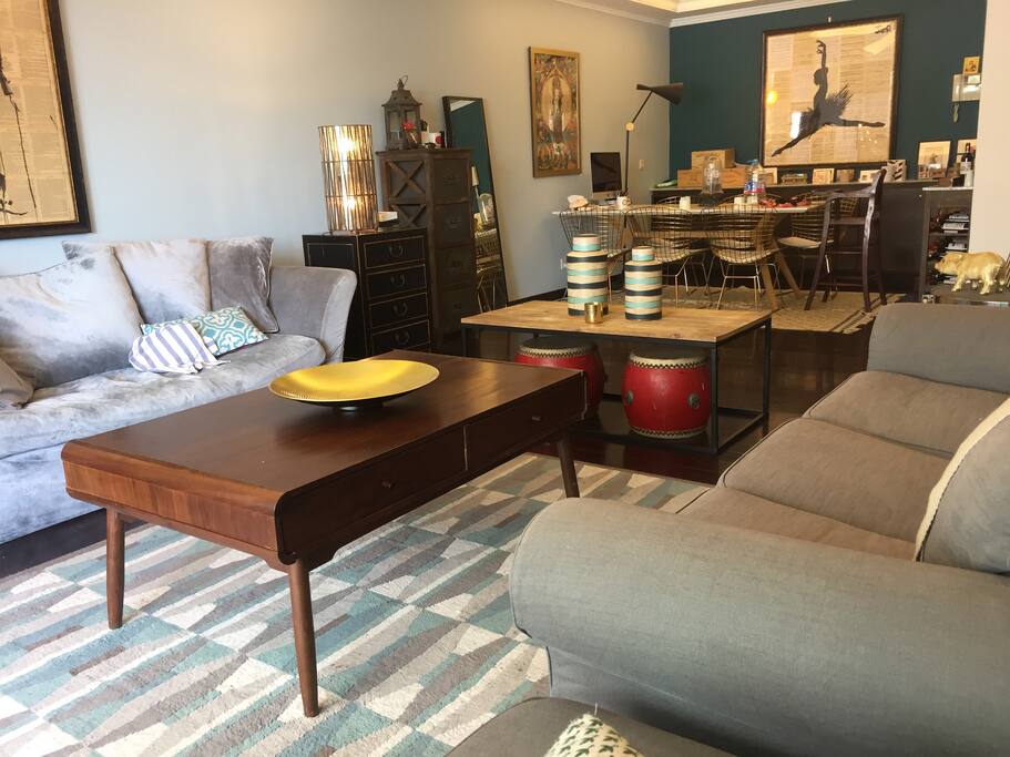 Living room with 8 seats dining table, 2 sofas and one large terrasse