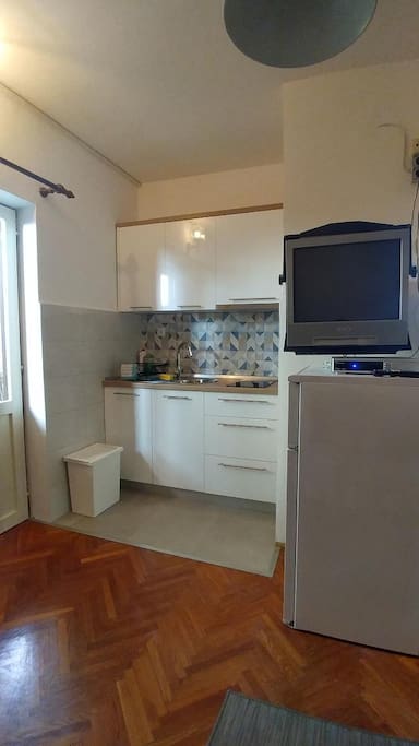 Kitchen, refrigerator and TV