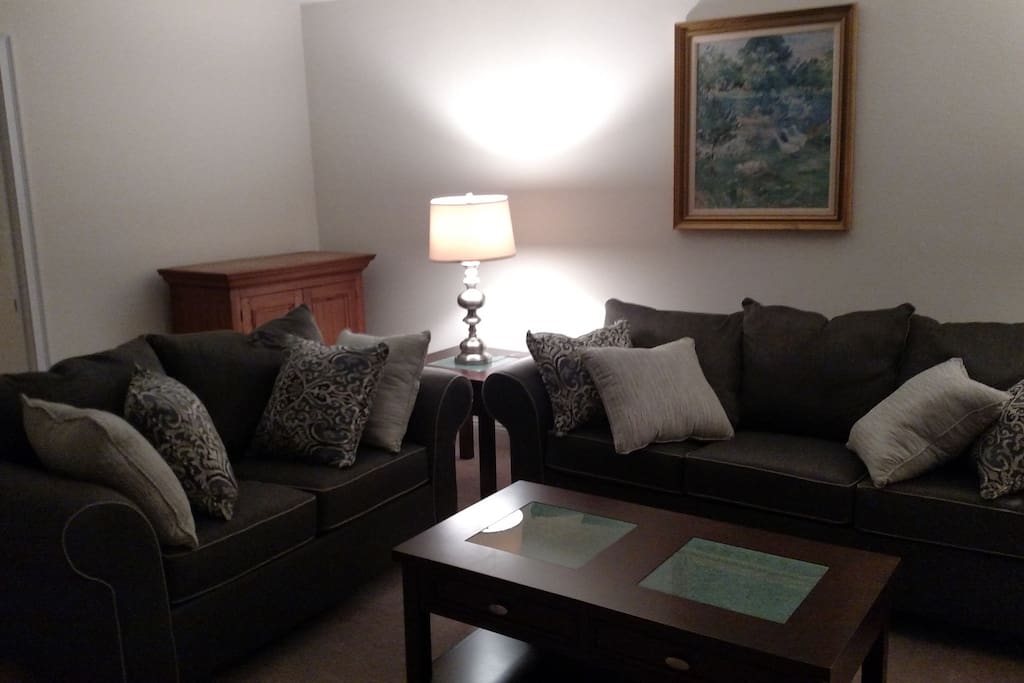 Den with sofa bed and loveseat
