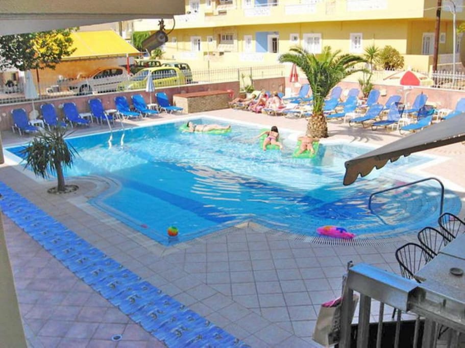 lounge area beside the pool