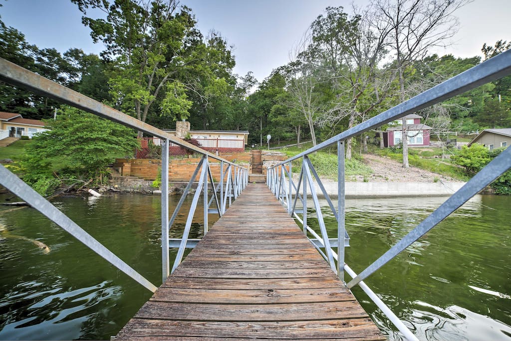 Life is better at the lake in this 2-bedroom, 1-bathroom waterfront vacation rental home on the Little Niangua River.