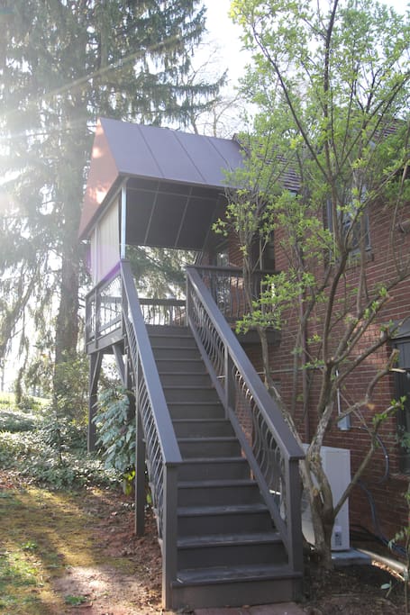 Tucked above the Carriage House with it's own private entrance behind the building.